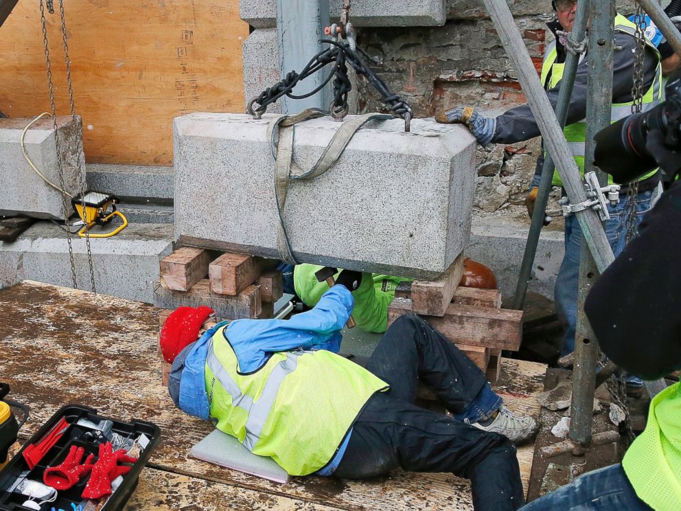 PHOTO: Massachusetts officials work to remove a time capsule in the cornerstone of the Statehouse in Boston, Dec. 11, 2014.