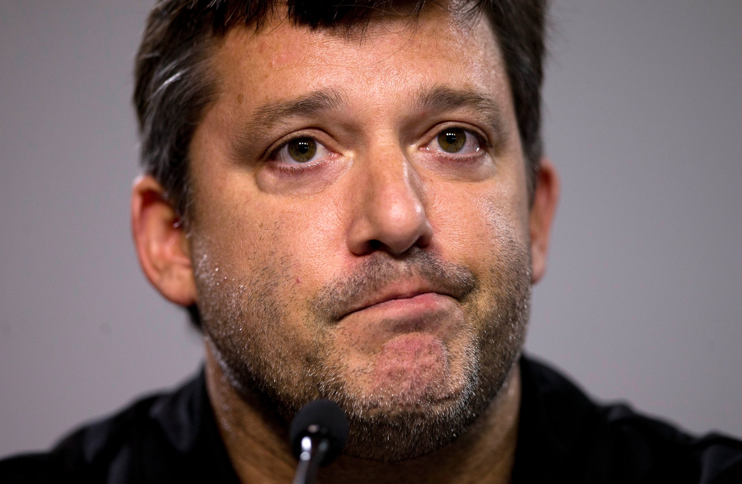PHOTO: NASCAR auto racing driver Tony Stewart reads a statement during a news conference at Atlanta Motor Speedway in Hampton, Ga., Aug. 29, 2014.