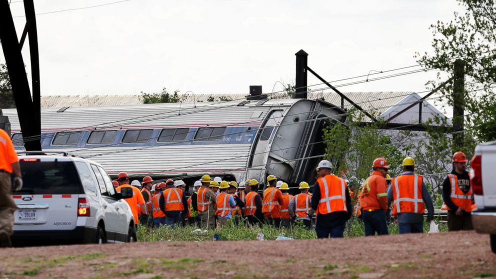 PHOTO: Emergency personnel gather near the scene of a deadly train derailment, May 13, 2015, in Philadelphia.