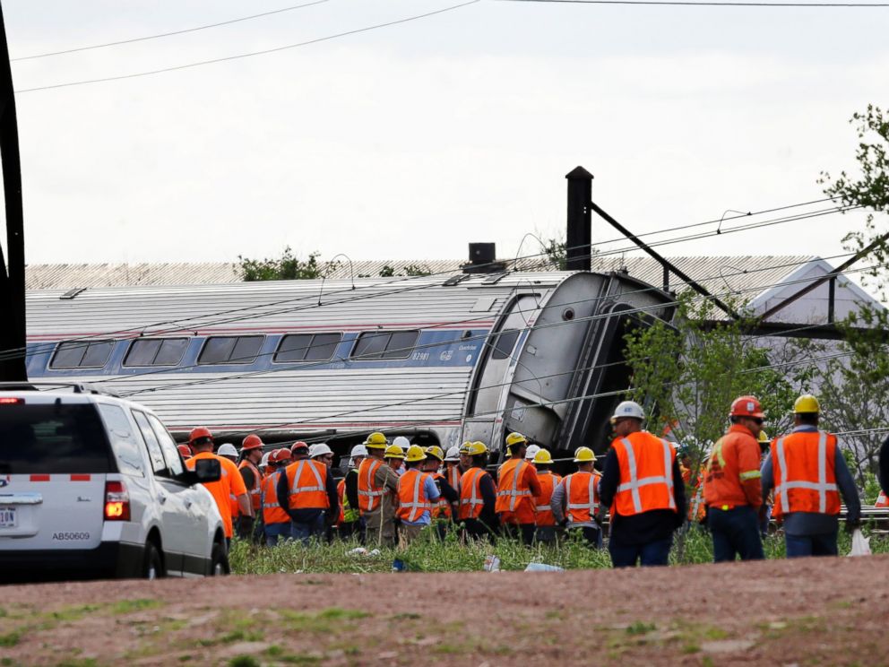 PHOTO: Emergency personnel gather near the scene of a deadly train derailment, May 13, 2015, in Philadelphia.