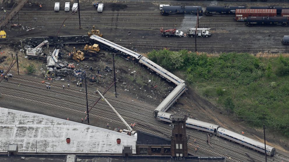 Emergency personnel work at the scene of a deadly train derailment, May 13, 2015, in Philadelphia.