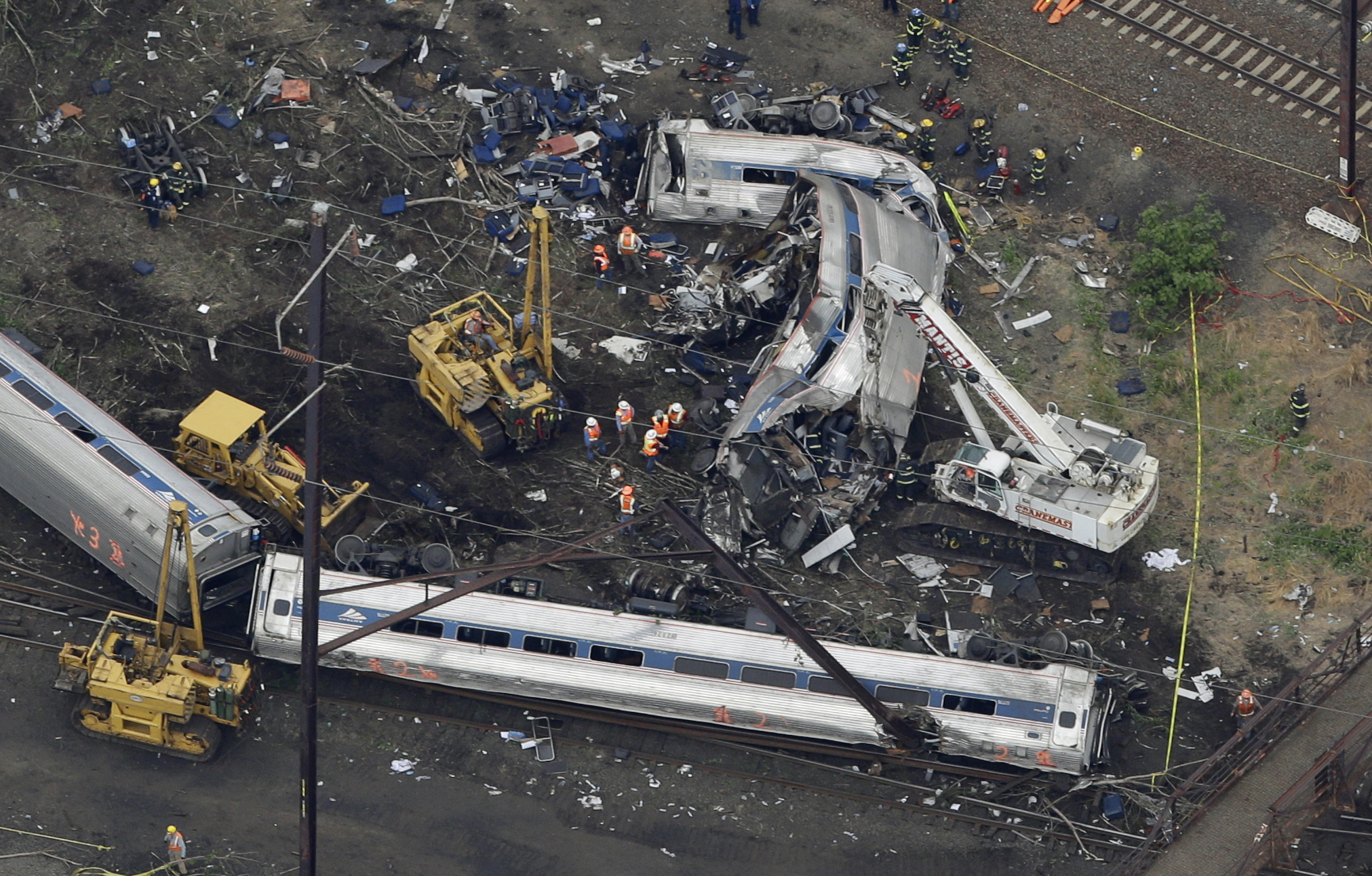 PHOTO: In this May 13, 2015, file photo, emergency personnel work at the scene of a deadly train wreck in Philadelphia. 