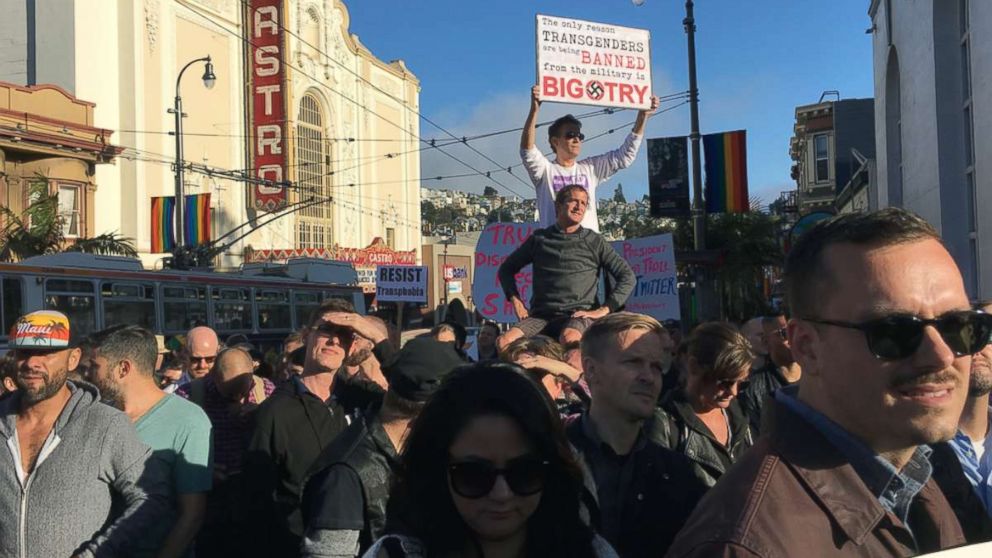 PHOTO: Protesters listen to speakers at a demonstration against a proposed ban of transgendered people in the military in the Castro District, Wednesday, July 26, 2017, in San Francisco.