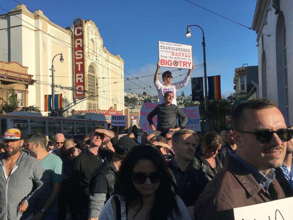 PHOTO: Protesters listen to speakers at a demonstration against a proposed ban of transgendered people in the military in the Castro District, Wednesday, July 26, 2017, in San Francisco.
