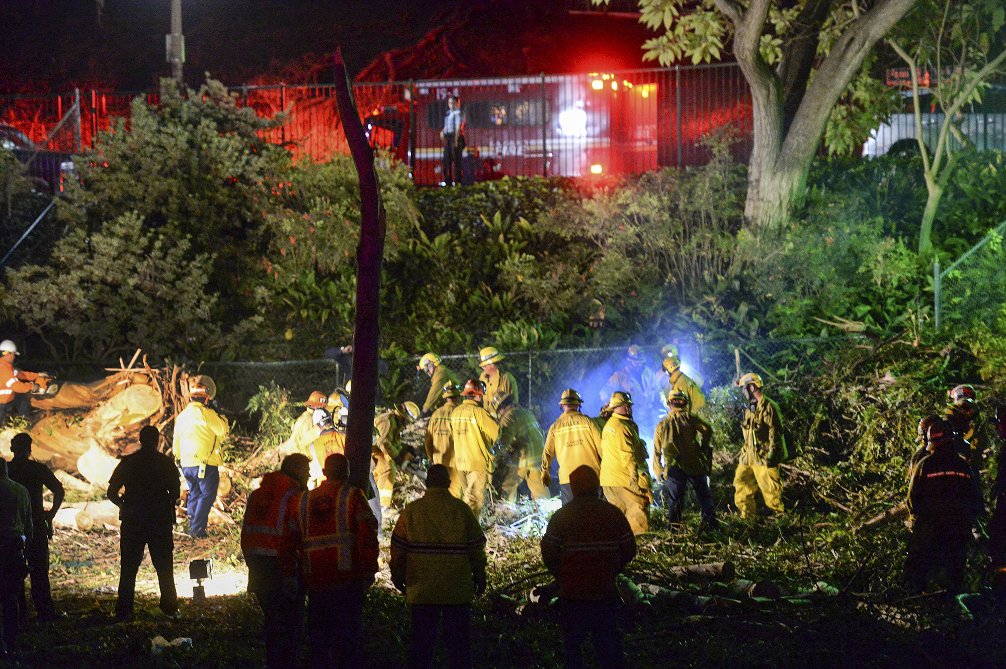 PHOTO: Los Angeles County Fire Dept. firefighters work at the scene where a large tree fell on a wedding party in Whittier, California, Dec. 17, 2016. 