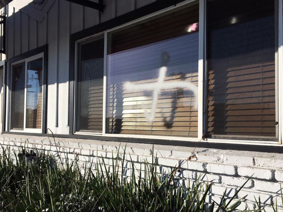PHOTO:This photo provided by the Ahmadiyya Muslim Community muslimsforpeace.org shows crosses in spray paint vandalizing windows at the Ahmadiyya Muslim Community Baitus-Salaam Mosque in Hawthorne, Calif., Dec. 13, 2015.