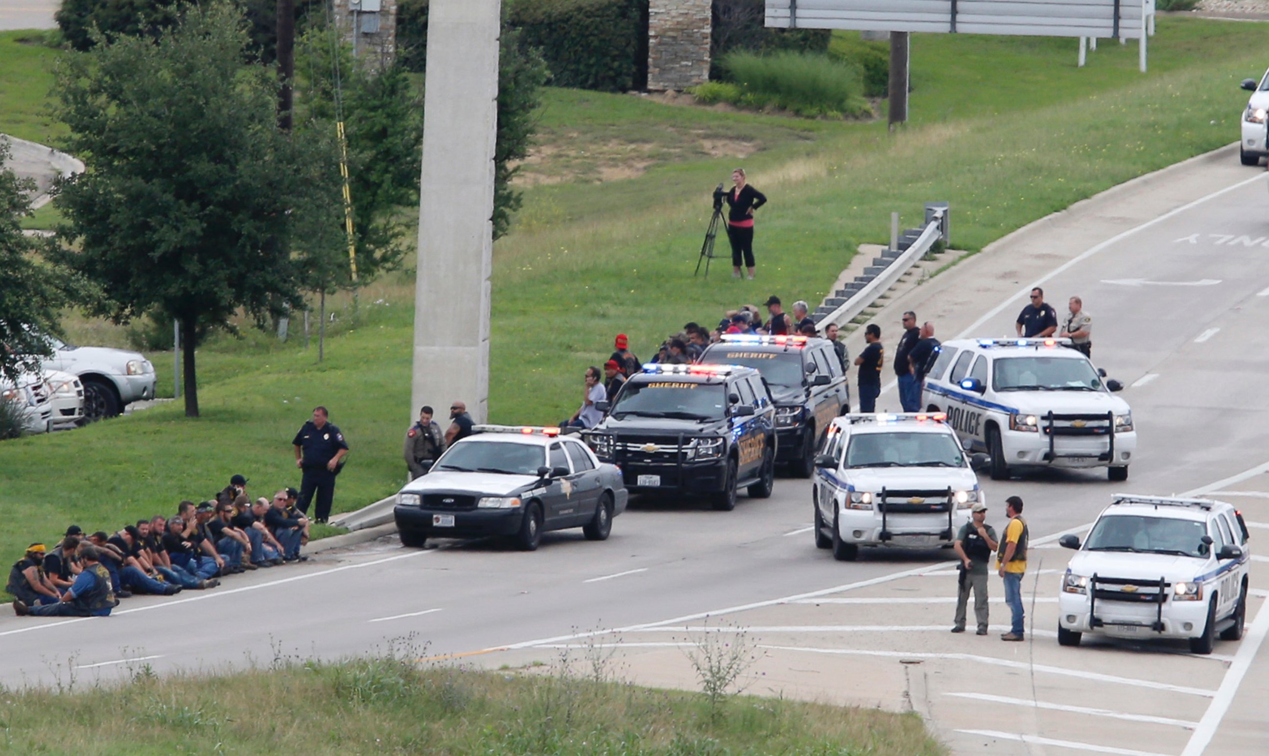 PHOTO: Authorities block an access road as an investigation continues near a Twin Peaks restaurant 