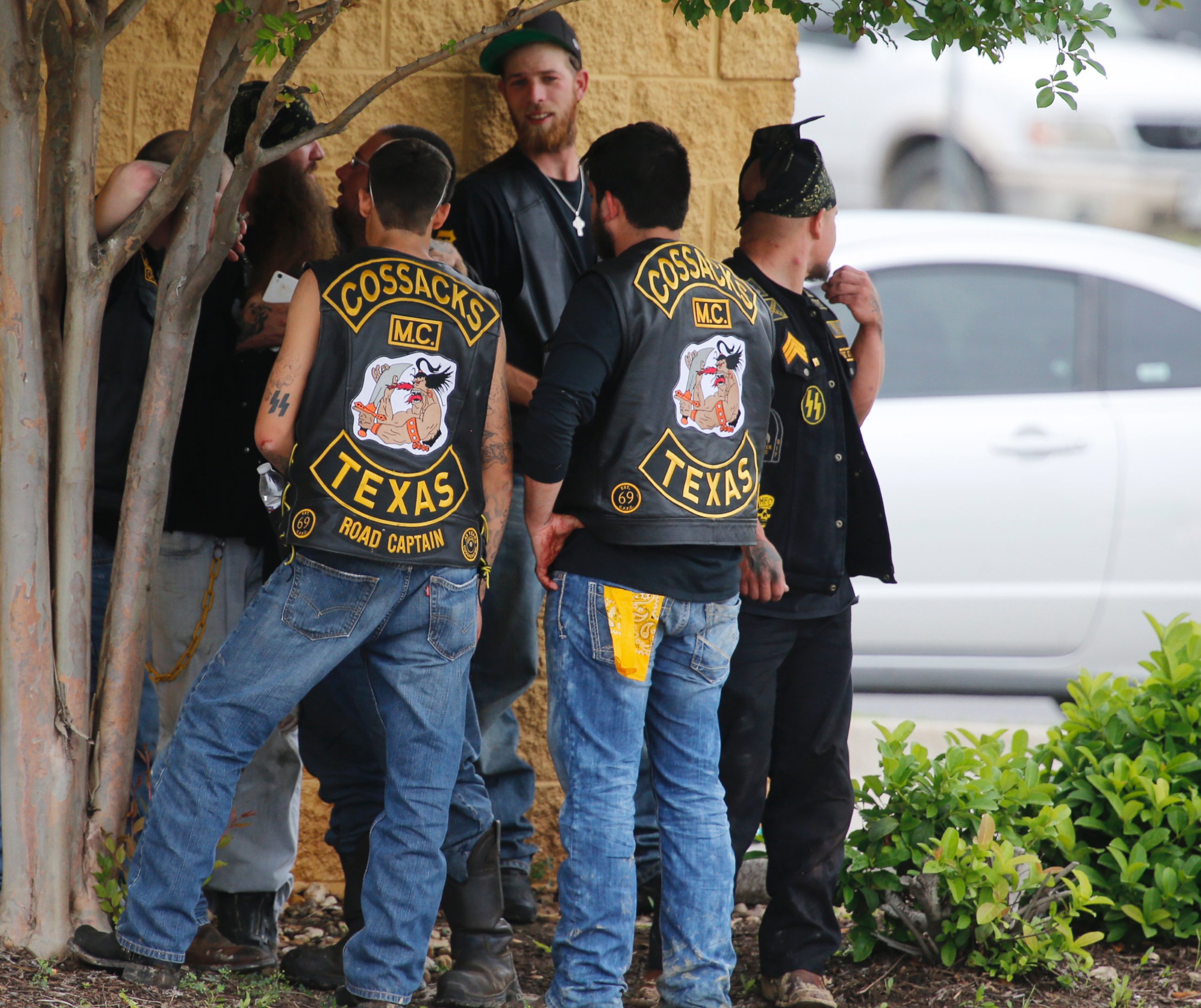 PHOTO: Bikers congregate against a wall while authorities investigate a Twin Peaks restaurant