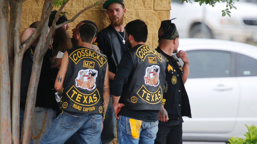 PHOTO: Bikers congregate against a wall while authorities investigate a Twin Peaks restaurant