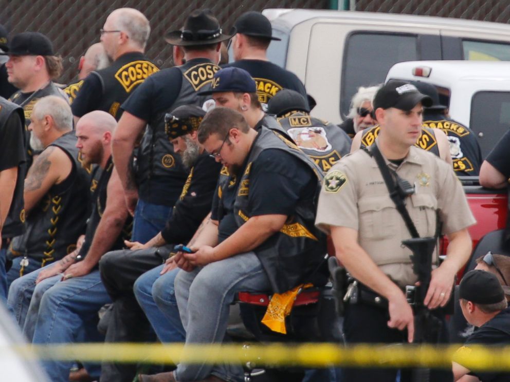 PHOTO: A McLennan County deputy stands guard near a group of bikers in the parking lot of a Twin Peaks restaurant Sunday, May 17, 2015, in Waco, Texas. 