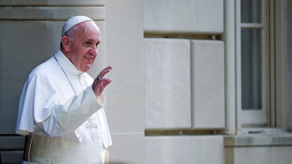 Pope Francis waves as he departs the Apostolic Nunciature, the Vatican's diplomatic mission in Washington, Sept. 24, 2015, en route to the Capitol to address a joint meeting of Congress.