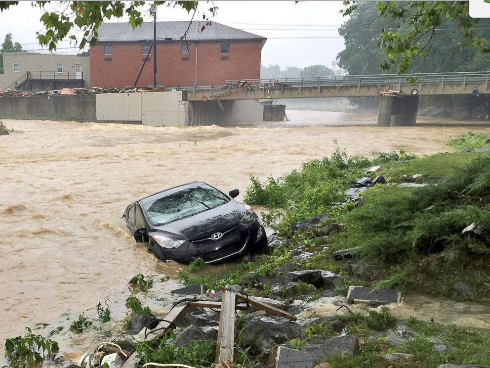 PHOTO: In this photo released by the The Weather Channel, a vehicle rests on the in a stream after a heavy rain near White Sulphur Springs, W.Va., June 24, 2016.