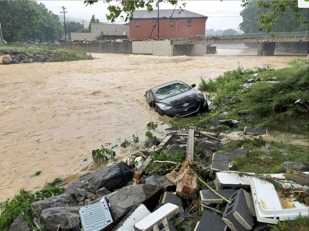 PHOTO: In this photo released by The Weather Channel, a vehicle rests in a stream after heavy rain near White Sulphur Springs, W.Va., June 24, 2016.