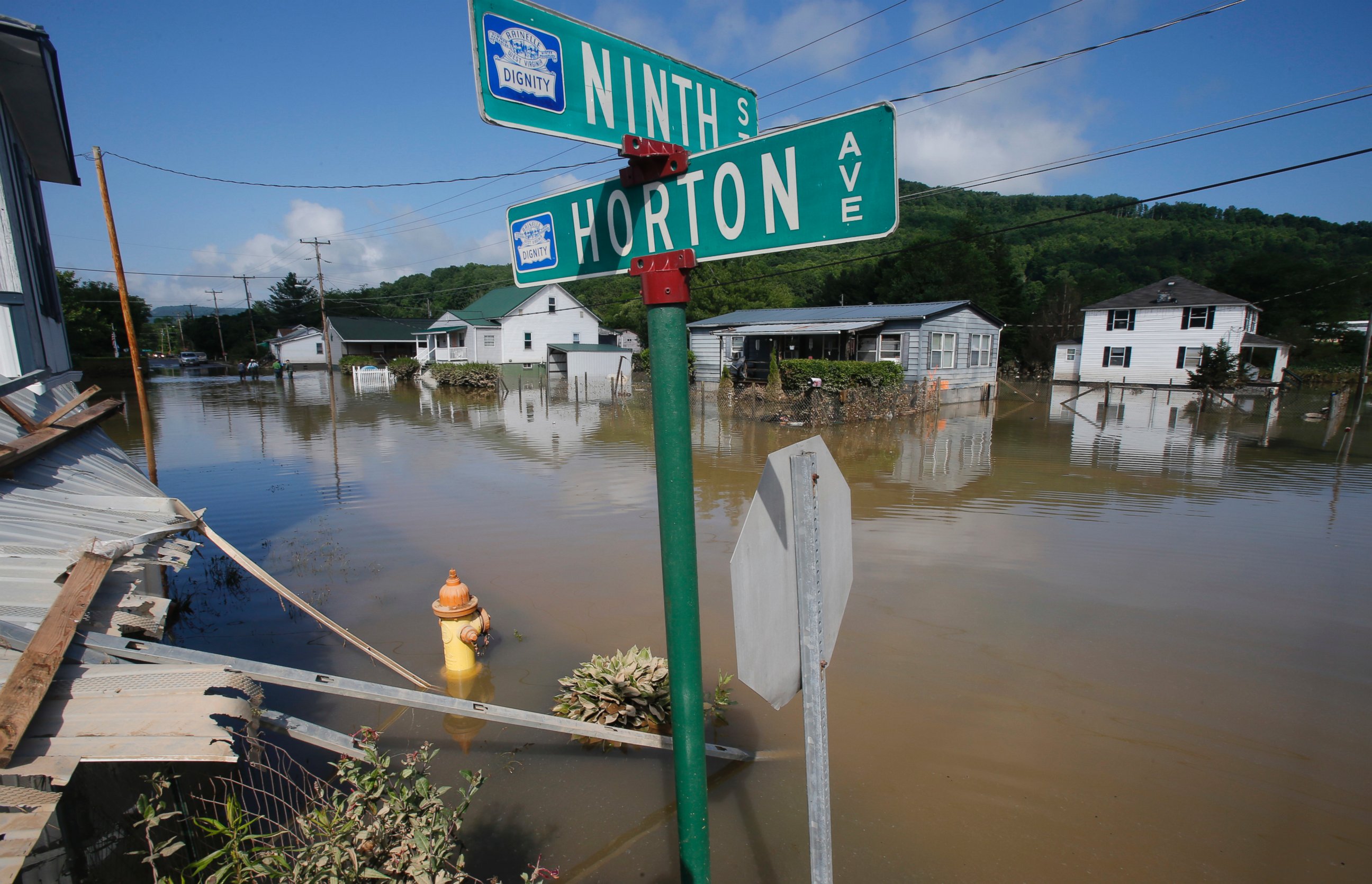 PHOTO: Flooded homes are still surrounded by water in Rainelle, W. Va., June 25, 2016.  