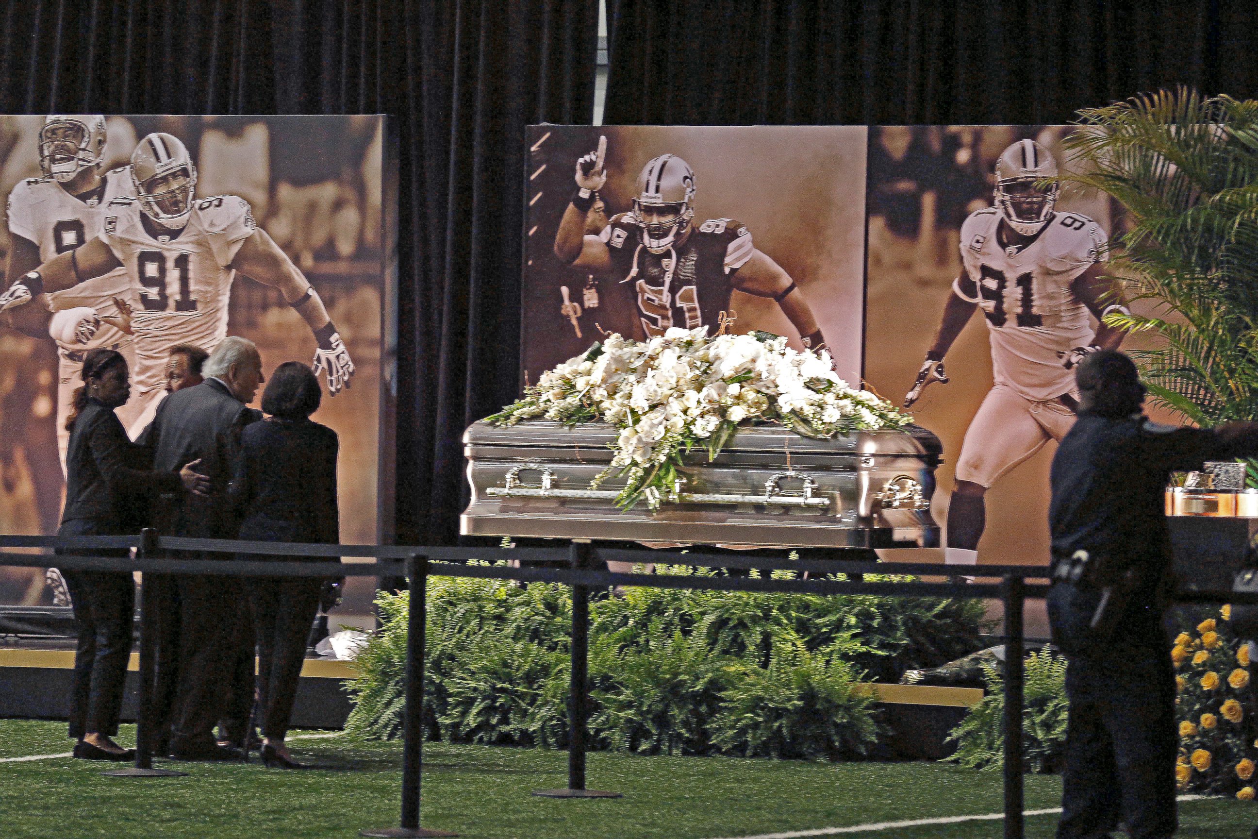 PHOTO: New Orleans Saints owner Tom Benson and his wife Gayle Benson view the casket of former Saints defensive end Will Smith during a public viewing inside the Saints training facility in Metairie, Louisiana, April 15, 2016. 