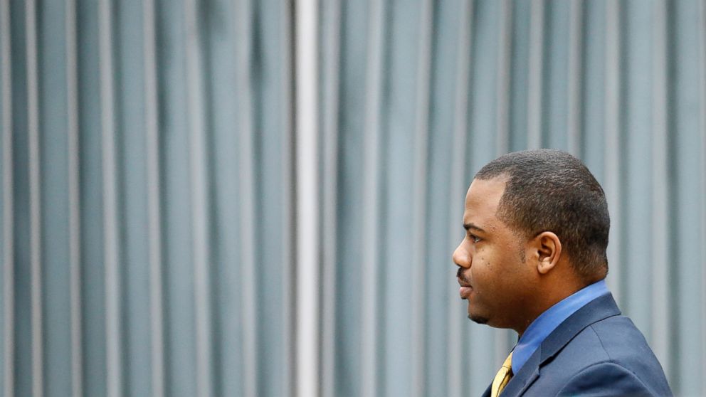 William Porter, one of six Baltimore city police officers charged in connection to the death of Freddie Gray, walks to a courthouse for jury selection in his trial, Nov. 30, 2015, in Baltimore. 