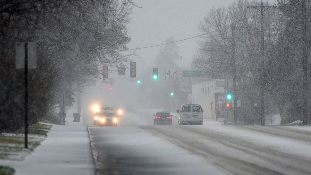 PHOTO: Traffic slows as heavy snow begins to fall, Nov. 18, 2016 in St. Cloud, Minnesota. 