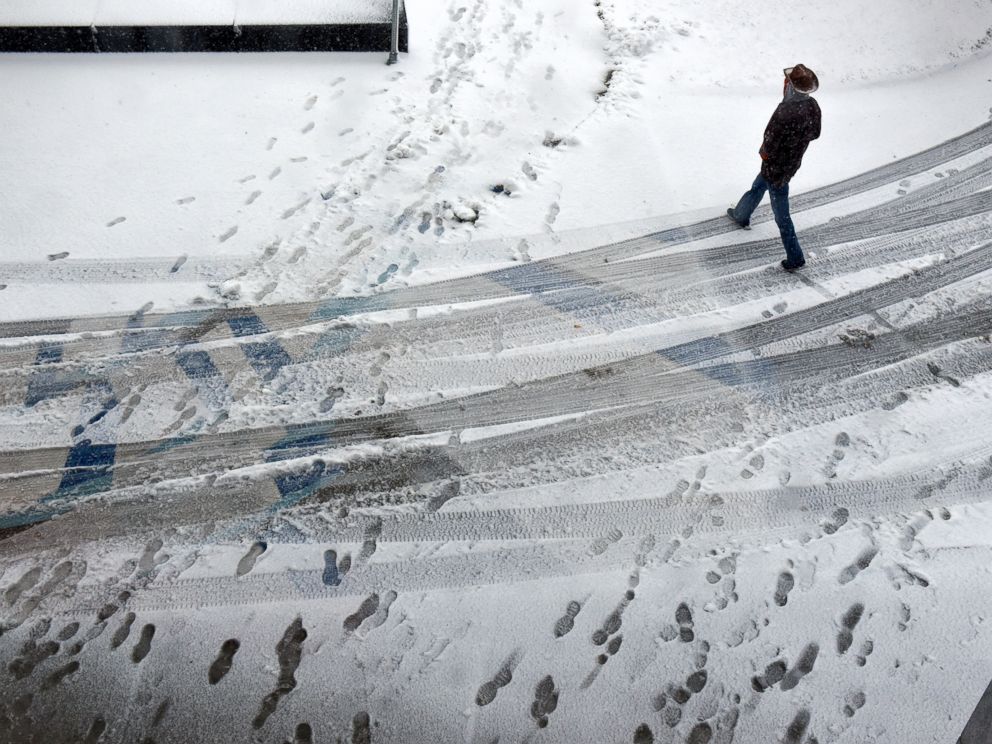 PHOTO: A man walks in the snow near the entrance to the St. Cloud Public Library, Nov. 18, 2016 in St. Cloud, Minnesota.