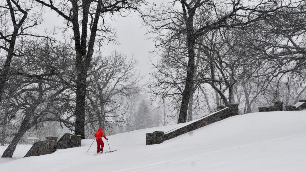 Wren Scott-Lumbar, 11, skis at Hester Park, Nov. 10, 2014, in St. Cloud, Minn., during the region's first major snowfall of the season.