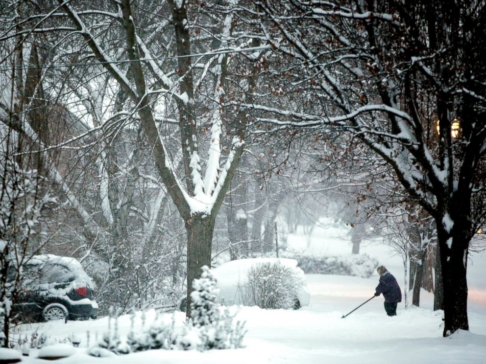 PHOTO: Jackie Johnson shovels out her driveway along East Chicago Street in Elgin, Ill., on Sunday, Feb. 1, 2015.