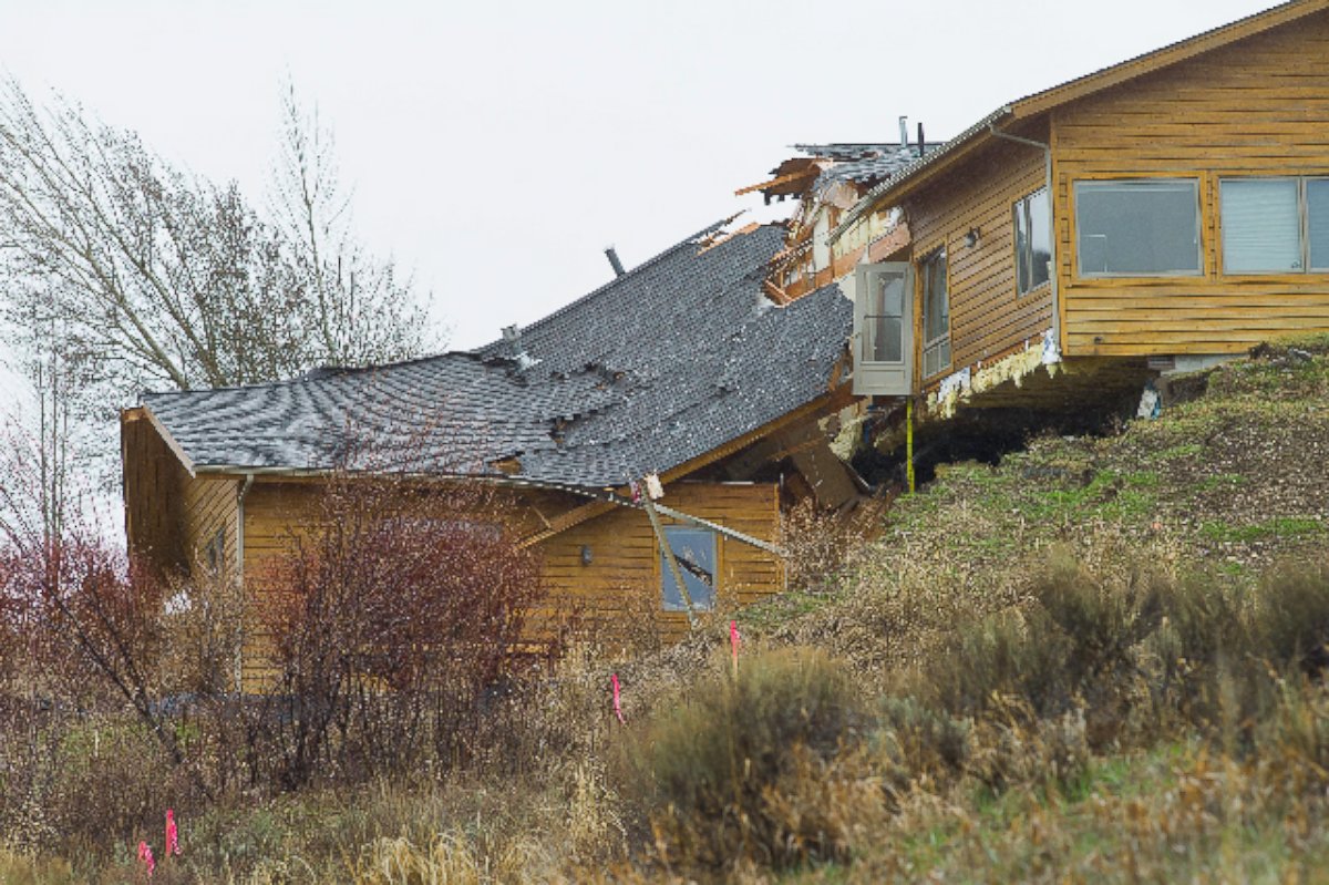 PHOTO: A house breaks apart as a slow-moving landslide in Jackson, Wyo. advances downhill on Friday, April 18. 2014. 