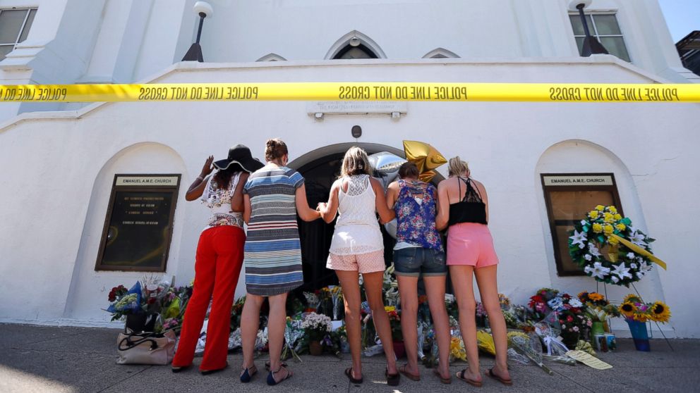 PHOTO:A group of women pray together at a make-shift memorial on the sidewalk in front of the Emanuel AME Church, June 18, 2015 in Charleston, S.C. 