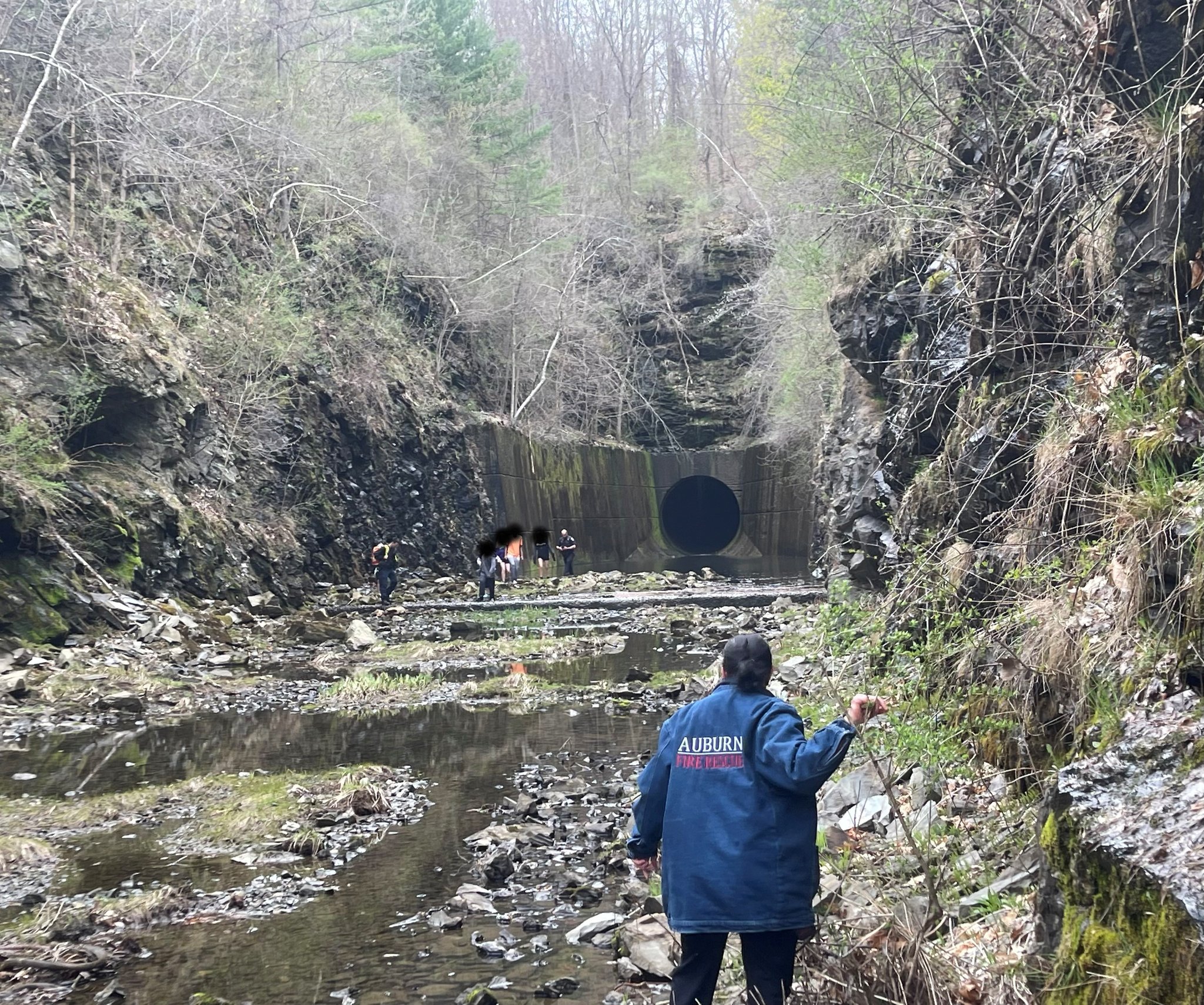 PHOTO: Members of the Auburn Fire Department help rescue teenagers near a diversion water tunnel in Auburn, Massachusetts, on March 16, 2023.