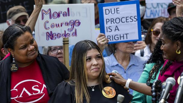 Jennifer Vasquez Sura, wife of Kilmar Abrego Garcia, joins supporters rallying for Garcia's return from El Salvador prior to a status hearing outside the federal court house in Greenbelt, Maryland, May 16, 2025.