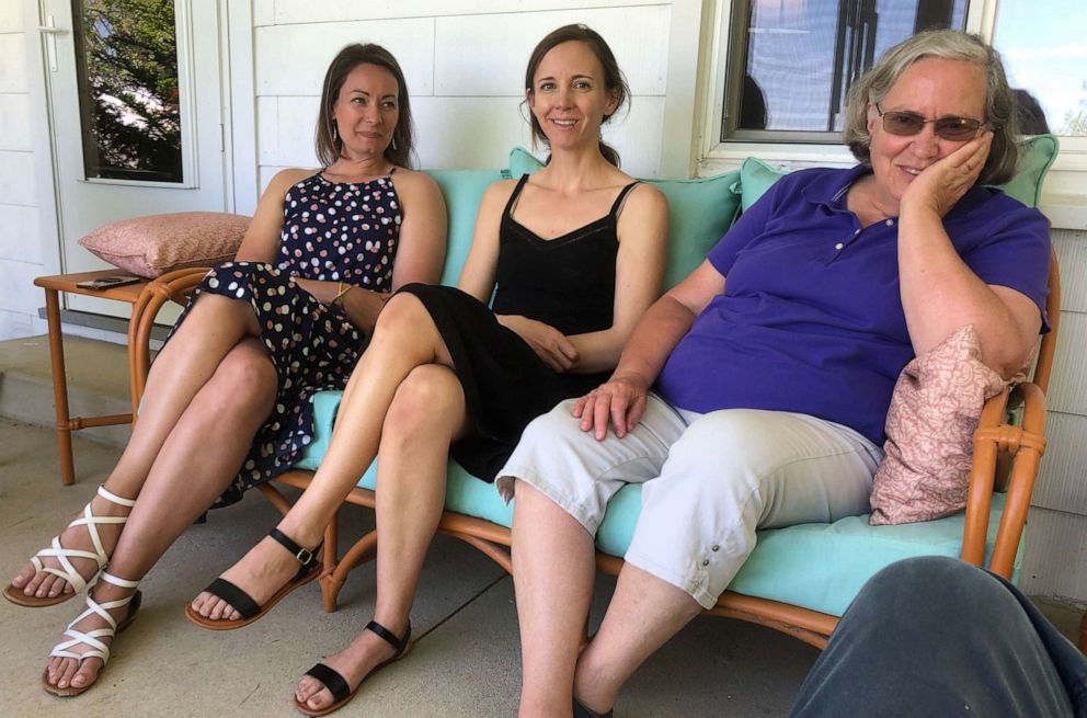 PHOTO: Karla Barnes (right) sits on her porch after a family dinner, with her daughter Becky Tilley (center) and daughter-in-law Adrienne Barnes (left).