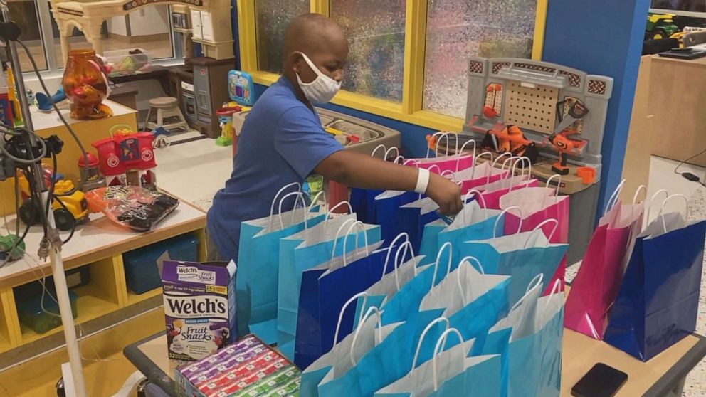 Boy with cancer prepares gift bags for fellow patients