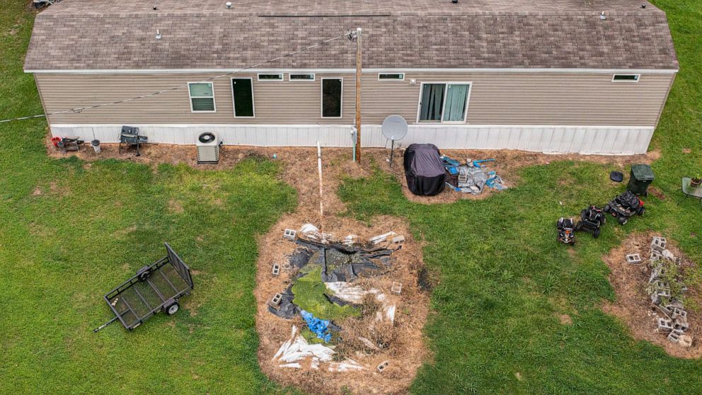 PHOTO: The failing septic tank buried behind Mautree Burke's home causes sewage to rise to the surface of her backyard.