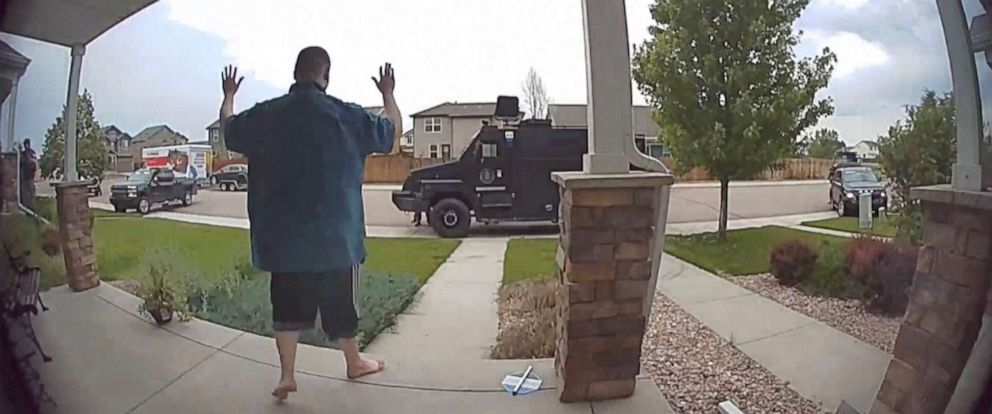 PHOTO: In this image from video provided by Leslie Bowman, Anderson Lee Aldrich surrenders to police at a home where his mother, Laura Voepel, was renting a room in Colorado Springs, Colo., June 18, 2021. 