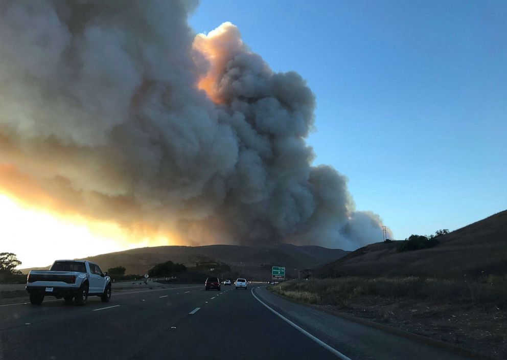 PHOTO: Smoke fills the sky as the Alisal fire burns in the distance, Oct. 11, 2021, in Santa Gaviota Coast, Calif. 