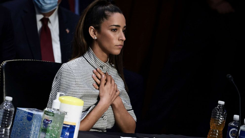 PHOTO: U.S. Olympic Gymnast Aly Raisman closes her eyes as NCAA and world champion gymnast Maggie Nichols gives her testimony during a Senate Judiciary hearing about the Larry Nassar investigation of sexual abuse, on Sept. 15, 2021, in Washington, D.C.