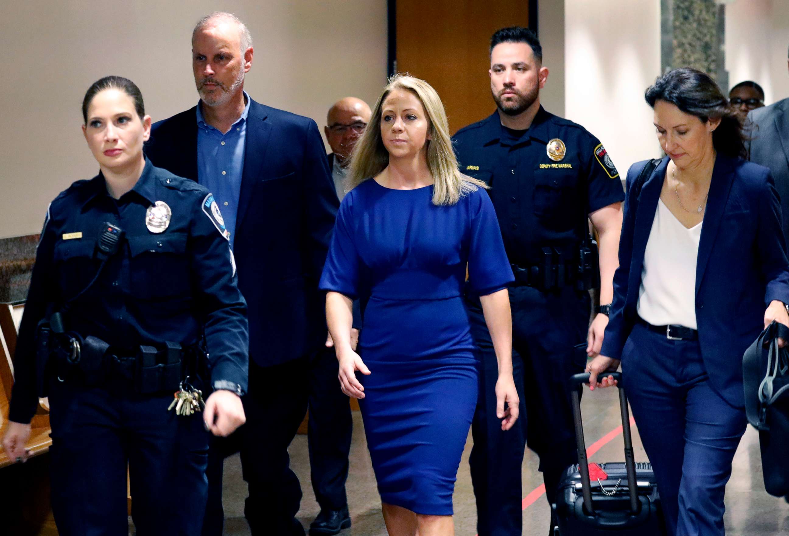 PHOTO: Former Dallas police officer Amber Guyger, center, arrives for the first day of her murder trial in the 204th District Court at the Frank Crowley Courts Building in Dallas, Texas, Sept. 23, 2019. 