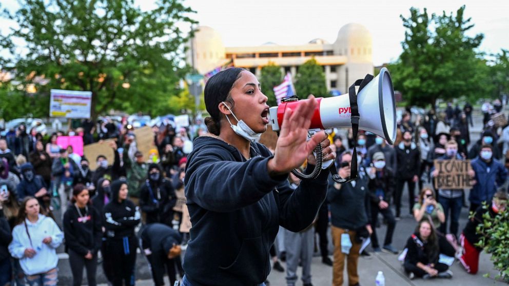 PHOTO: Organizer Renee White speaks to a group Black Lives Matter protesters gathered at the Spokane County Courthouse Sunday night, June 7, 2020. The death of George Floyd at the hands of police in Minneapolis has sparked protests for police reform.