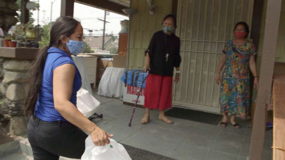 PHOTO: Aquilina Soriano Versoza delivers hot meals to Filipino families affected by the coronavirus pandemic in Los Angeles. 