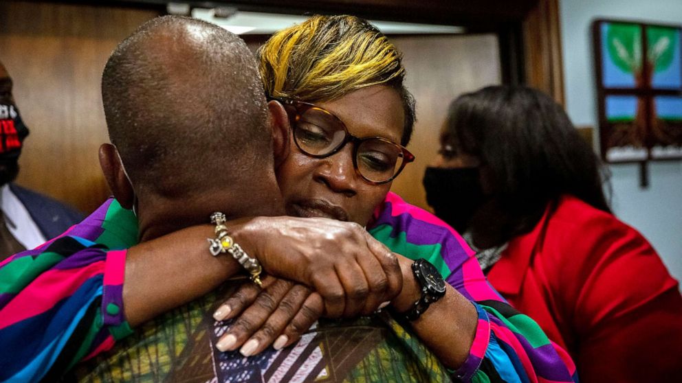 PHOTO: Ahmaud Arbery's mother, Wanda Cooper-Jones his hugged by a supporter after the jury convicted Travis McMichael in the trial of McMichael, his father, Greg McMichael, and neighbor, William "Roddie" Bryan, Nov. 24, 2021, in Brunswick, Ga.