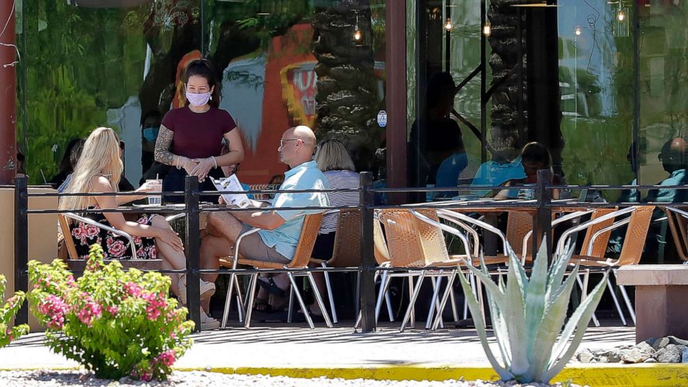PHOTO: Guests dine in-house at a restaurant, May 13, 2020, in Phoenix. Arizona Gov. Doug Ducey has allowed the reopening of restaurants in-house dining, gyms, spas and community swimming pools.