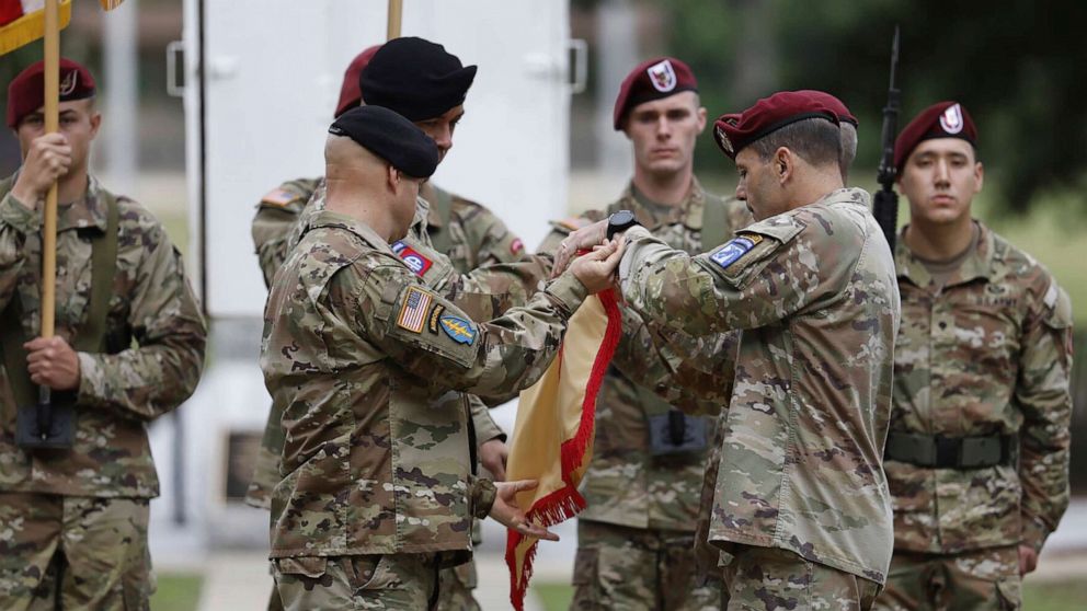 PHOTO: Lieutenant General Christopher T. Donahue, right, takes part of the Casing of the Colors during a ceremony to rename Fort Bragg, June 2, 2023 in Fort Bragg, N.C.
