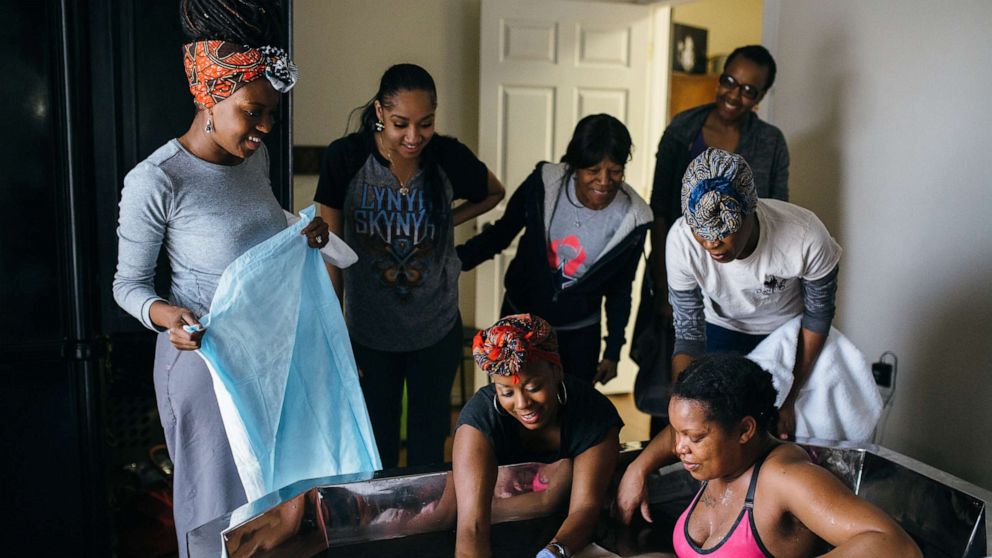 PHOTO: Tereé Fruga, Ebon’Nae Bradley and Kennasha Jones pictured at Justina Arrington's delivery in a birth pool in Arlington, Texas.