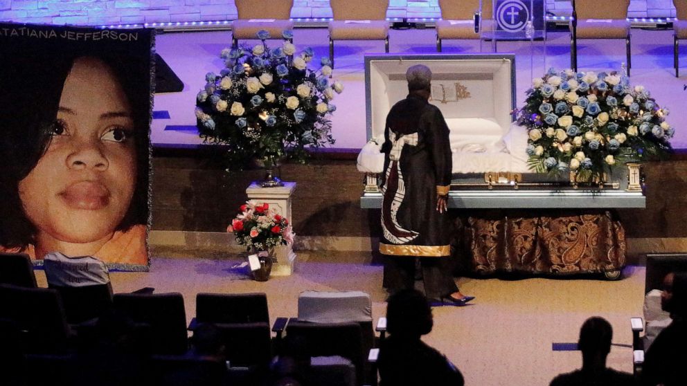 PHOTO: DALLAS, TX - OCTOBER 24: A mourner pays respects before the start of the funeral service for Atatiana Jefferson on October 24, 2019, at Concord Church in Dallas, Texas. (Photo by Stewart  F. House/Getty Images)