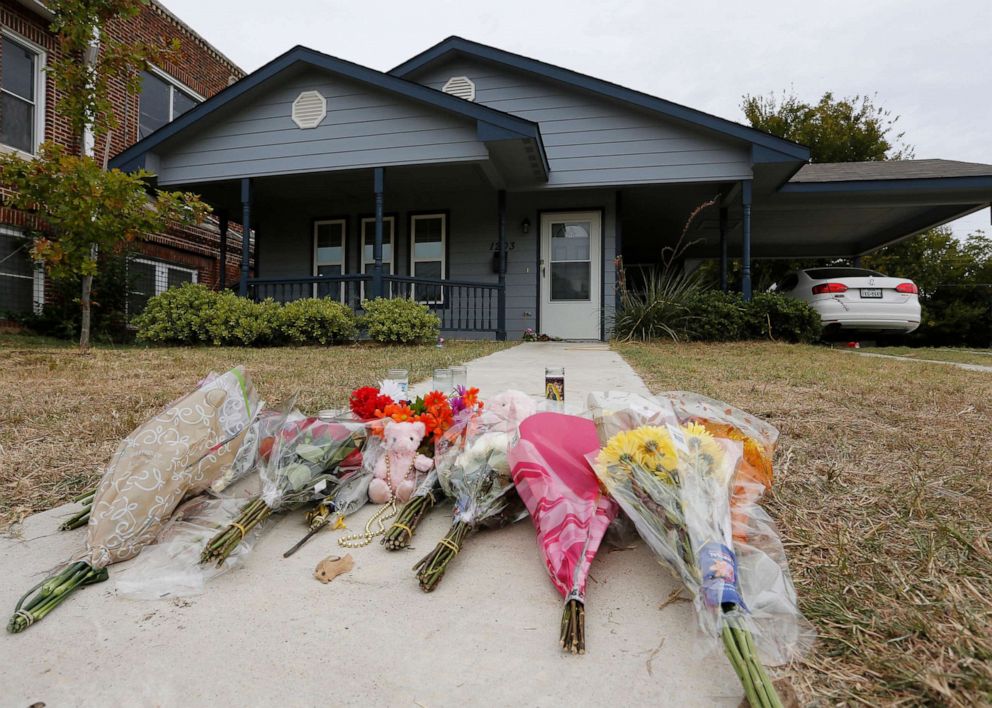 PHOTO: Flowers lie on the sidewalk in front of the house, Oct. 14, 2019, in Fort Worth, Texas, where a police officer shot and killed Atatiana Jefferson, through a back window of her home. 