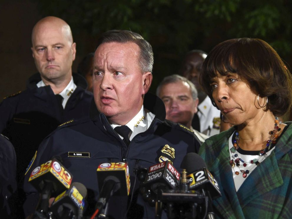PHOTO: Police commissioner Kevin Davis, center, talks to the press after a police officer was shot, as States Attorney for Baltimore Marilyn Mosby, left, and Baltimore Mayor Catherine Pugh, right, stand nearby, Nov. 15, 2017, in Baltimore.