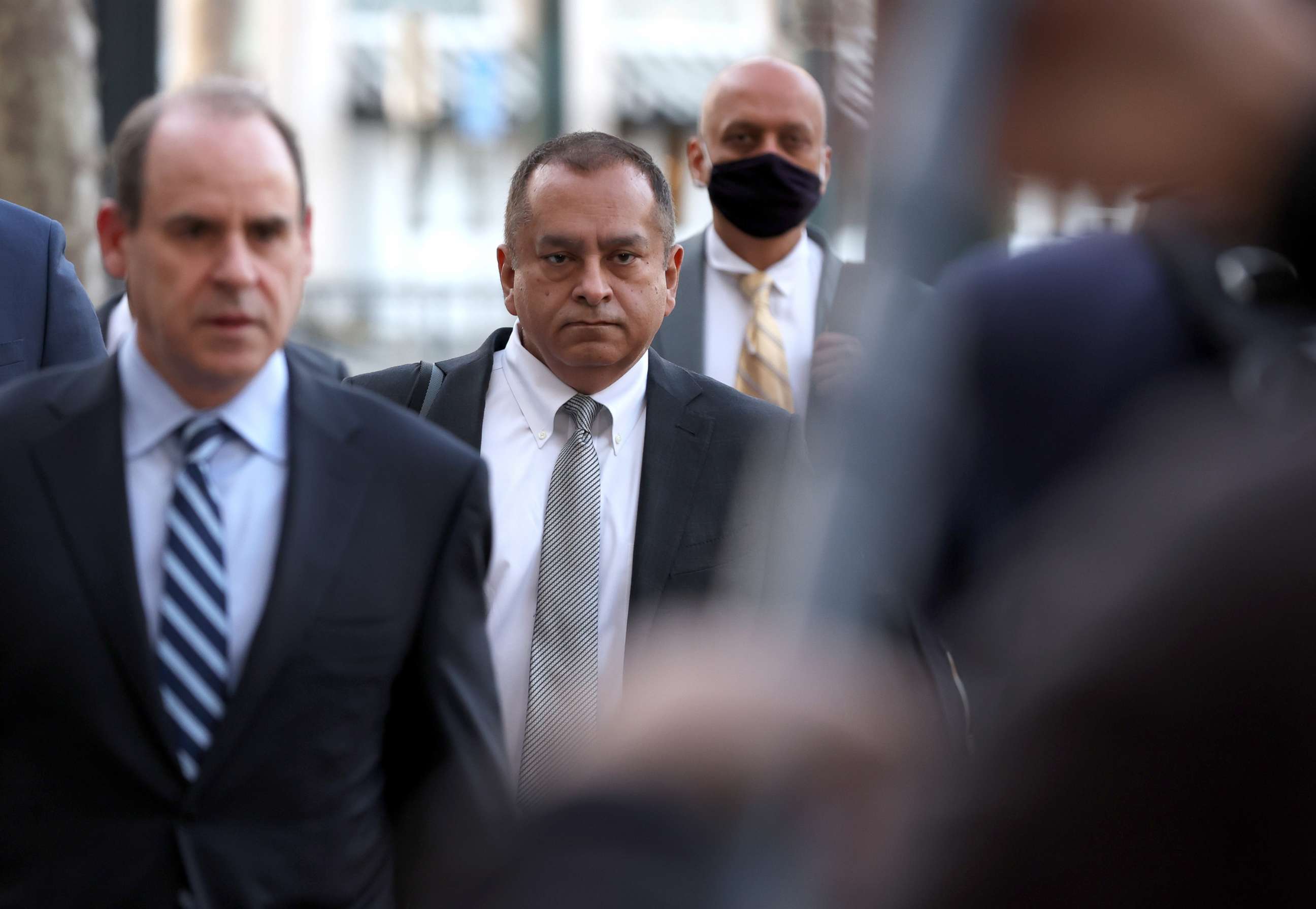 PHOTO: Former Theranos COO Ramesh "Sunny" Balwani (C) arrives at the Robert F. Peckham U.S. Federal Court with his legal team, March 16, 2022, in San Jose, Calif. 