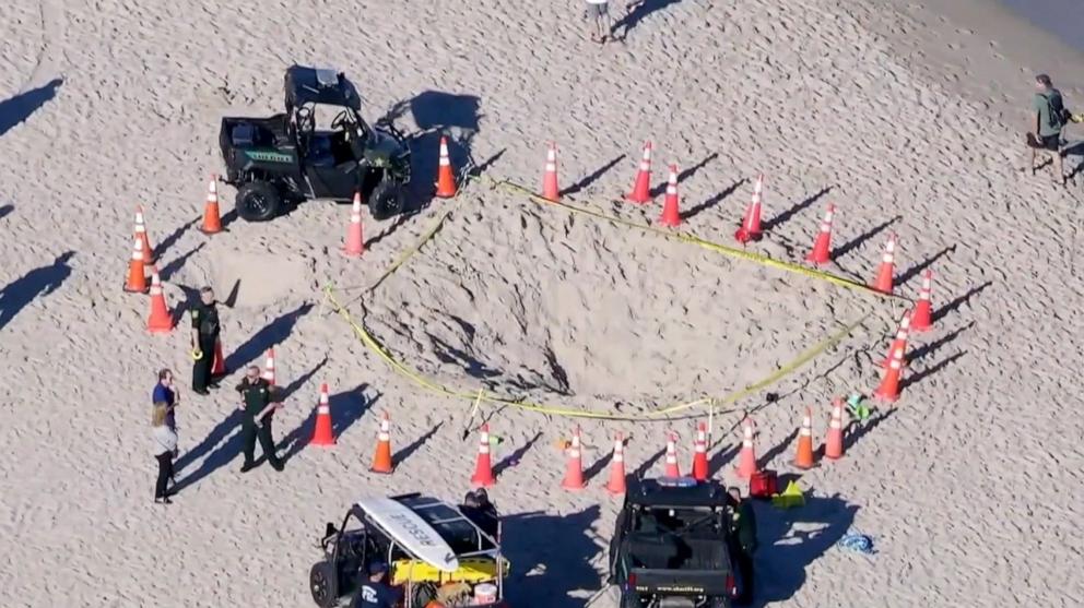 The girl and her brother were trapped in a deep hole they were digging at a South Florida beach.
