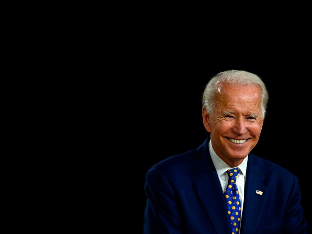 PHOTO: (FILES) In this file photo taken on July 28, 2020 US Democratic presidential candidate and former Vice President Joe Biden smiles as he speaks during a campaign event at the William "Hicks" Anderson Community Center in Wilmington, Delaware. 
