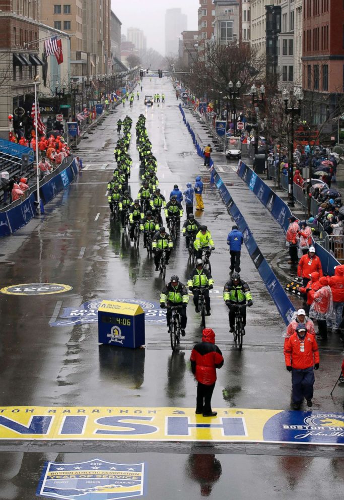 PHOTO: Bicycle-mounted police officers patrol at the finish line before the 122nd Boston Marathon, April 16, 2018, in Boston.