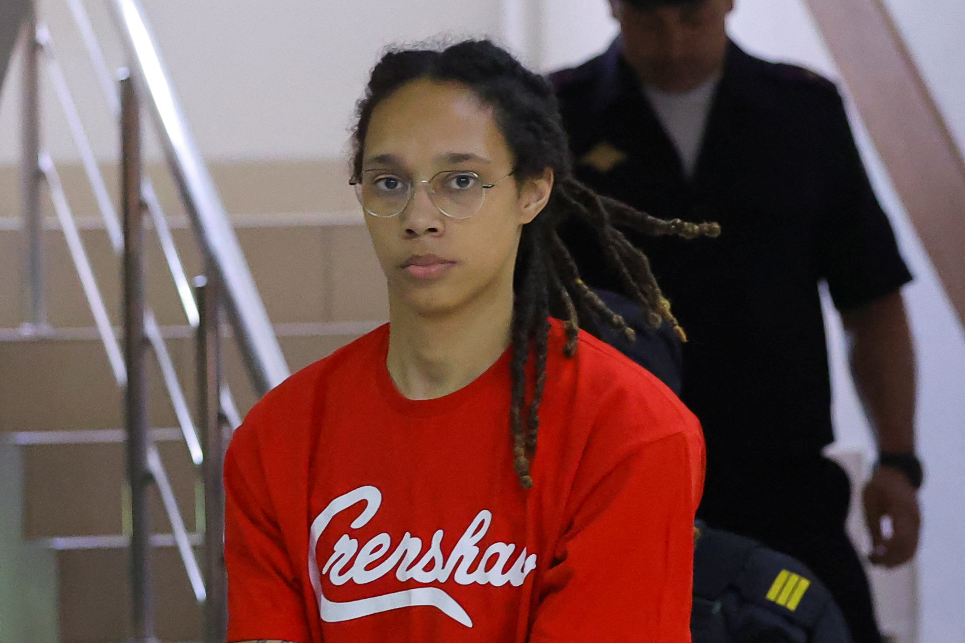 PHOTO: U.S. basketball player Brittney Griner, who was detained in March at Moscow's Sheremetyevo airport and later charged with illegal possession of cannabis, is escorted before a court hearing in Khimki, outside Moscow, Russia July 7, 2022.  