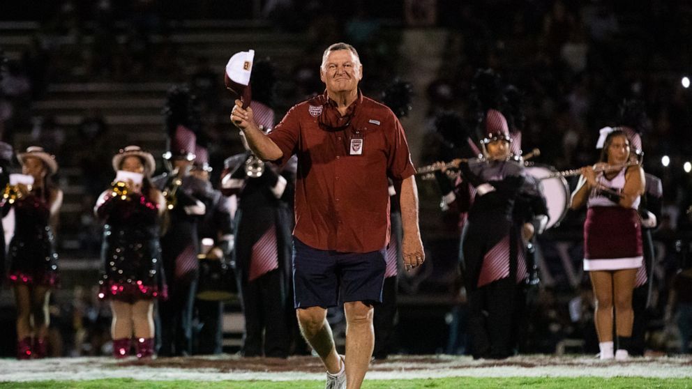 PHOTO: Buck Lanning of the 1972 championship Uvalde football team takes the field on Sept 2, 2022.